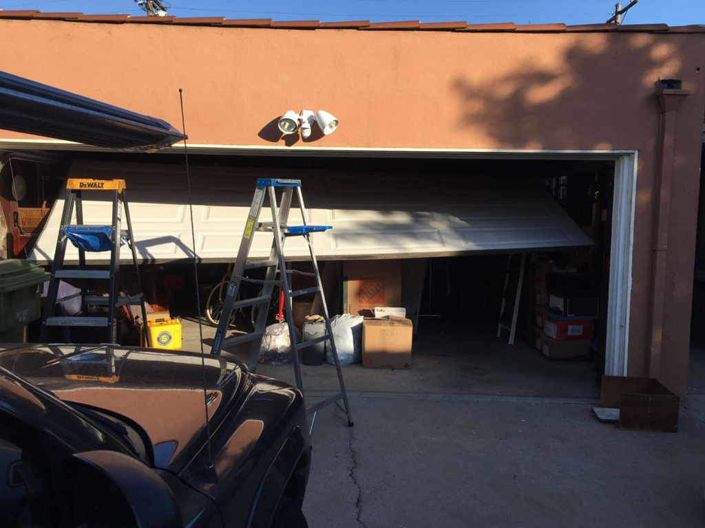 Garage Door Repair. Off Track Door.